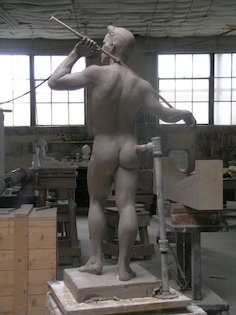 stone sculpture of standing man front